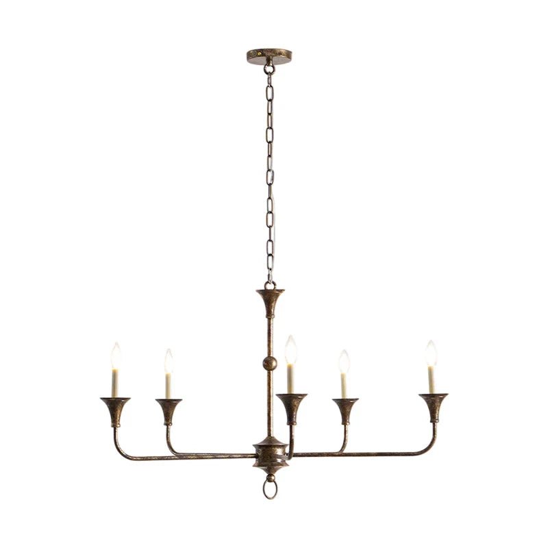 Classic chandelier light in antique brass with a candle-style design, featuring a flexible drop height, perfect for enhancing the elegance of dining rooms and entryways. 2