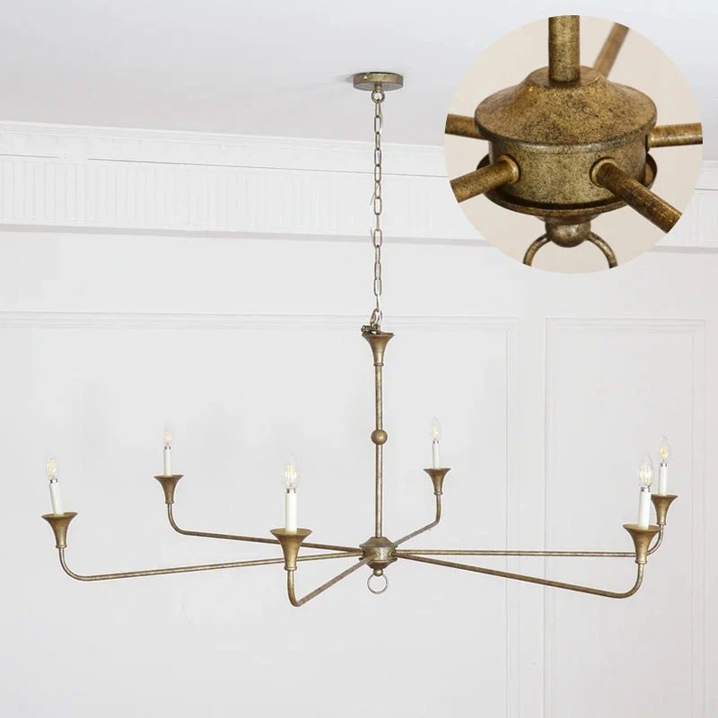 Classic chandelier light in antique brass with a candle-style design, featuring a flexible drop height, perfect for enhancing the elegance of dining rooms and entryways. 9