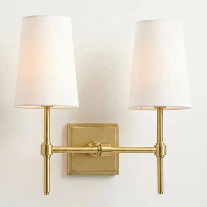 Classic wall light featuring a tapered linen shade and a dimmable function, available in elegant brass, sleek black, or modern brushed nickel finishes. 9