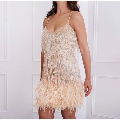 Elegant black cocktail dress featuring fringes and feathers, perfect for weddings and parties, showcasing a glamorous design suitable for evening wear. 11