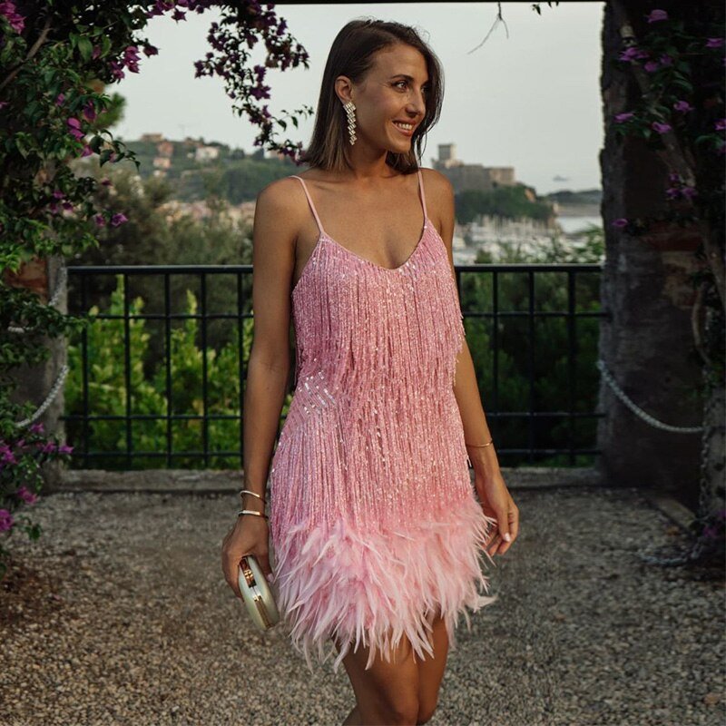Elegant black cocktail dress featuring fringes and feathers, perfect for weddings and parties, showcasing a glamorous design suitable for evening wear. 6