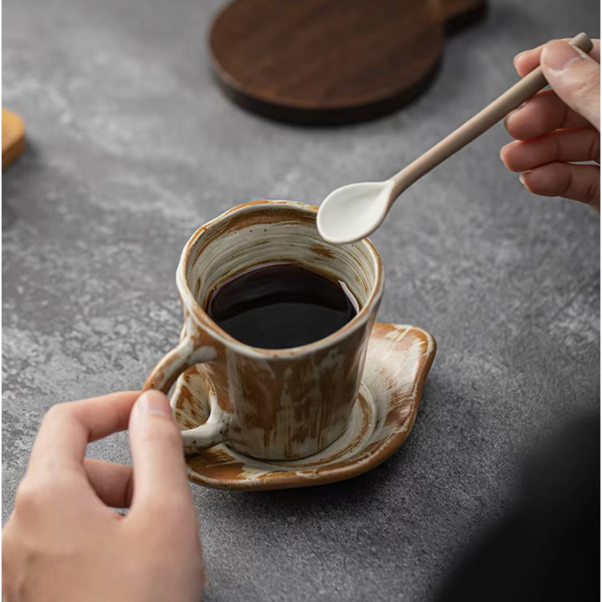 Handcrafted coffee stand featuring a ceramic dripper and a stylish wooden base, ideal for elegant pour-over brewing. 7