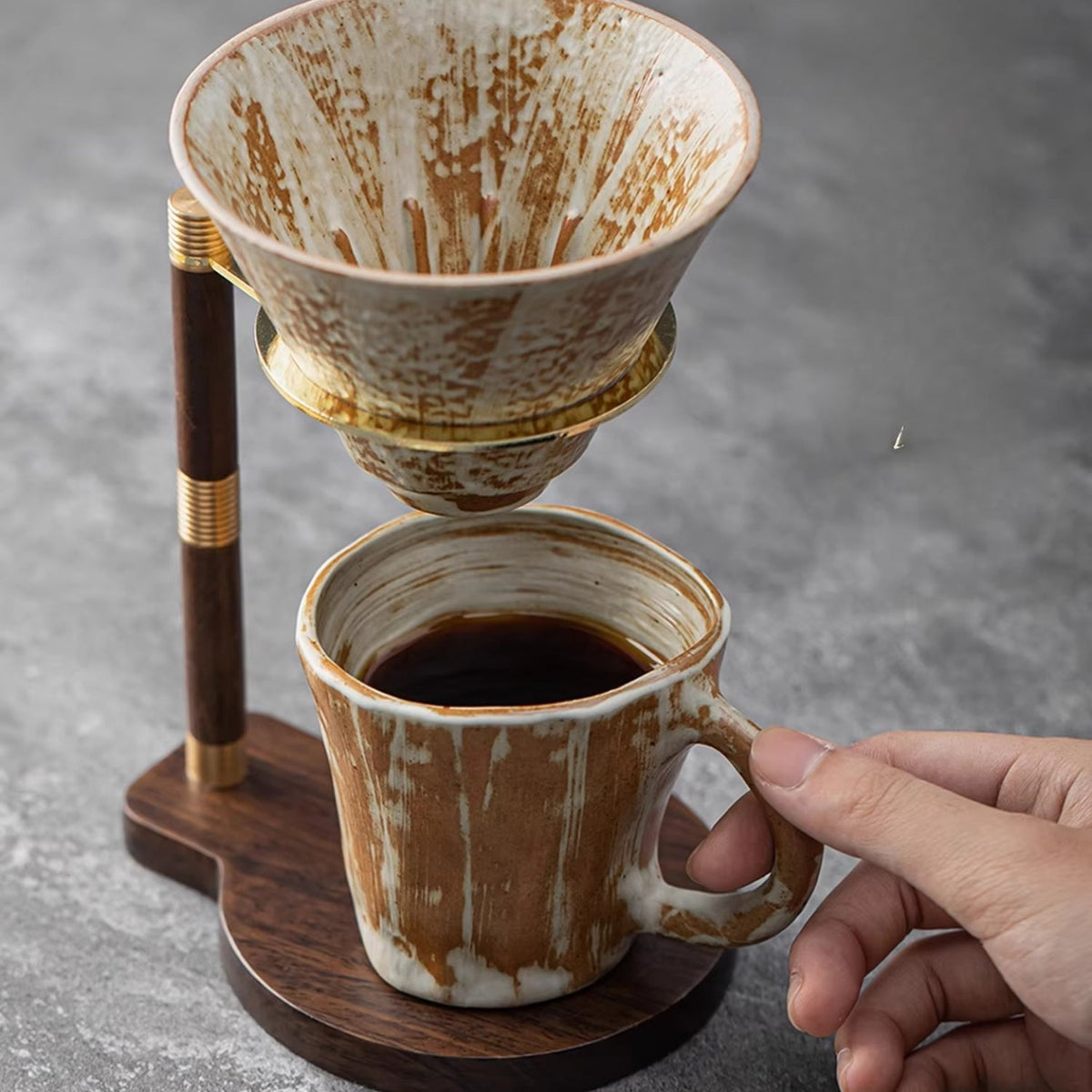 Handcrafted coffee stand featuring a ceramic dripper and a stylish wooden base, ideal for elegant pour-over brewing. 3