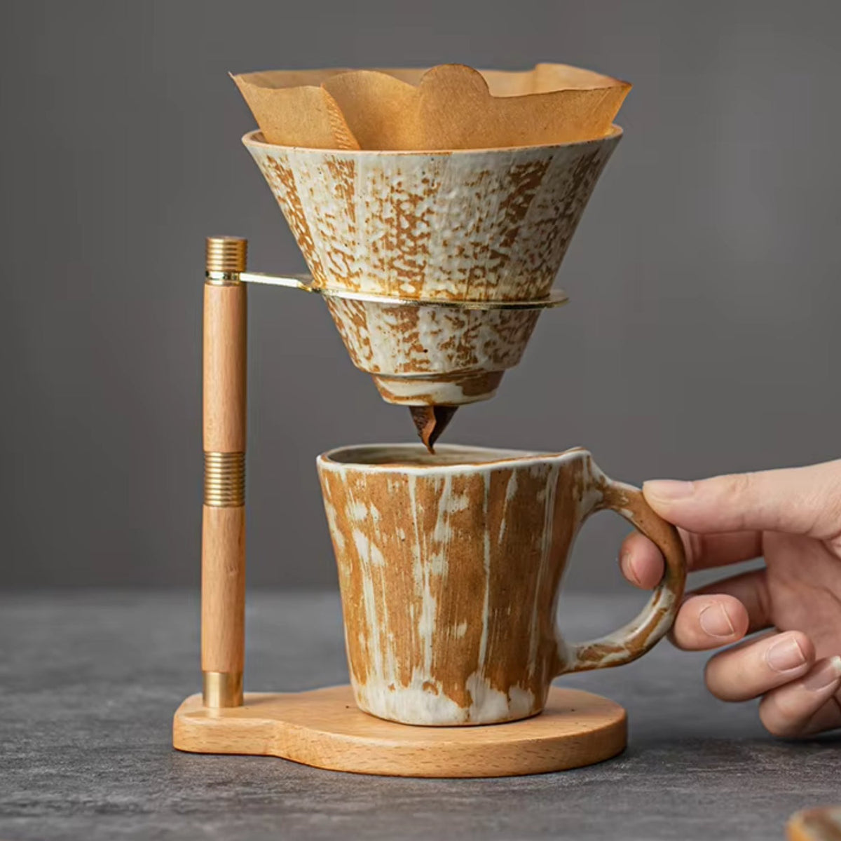 Handcrafted coffee stand featuring a ceramic dripper and a stylish wooden base, ideal for elegant pour-over brewing. 0