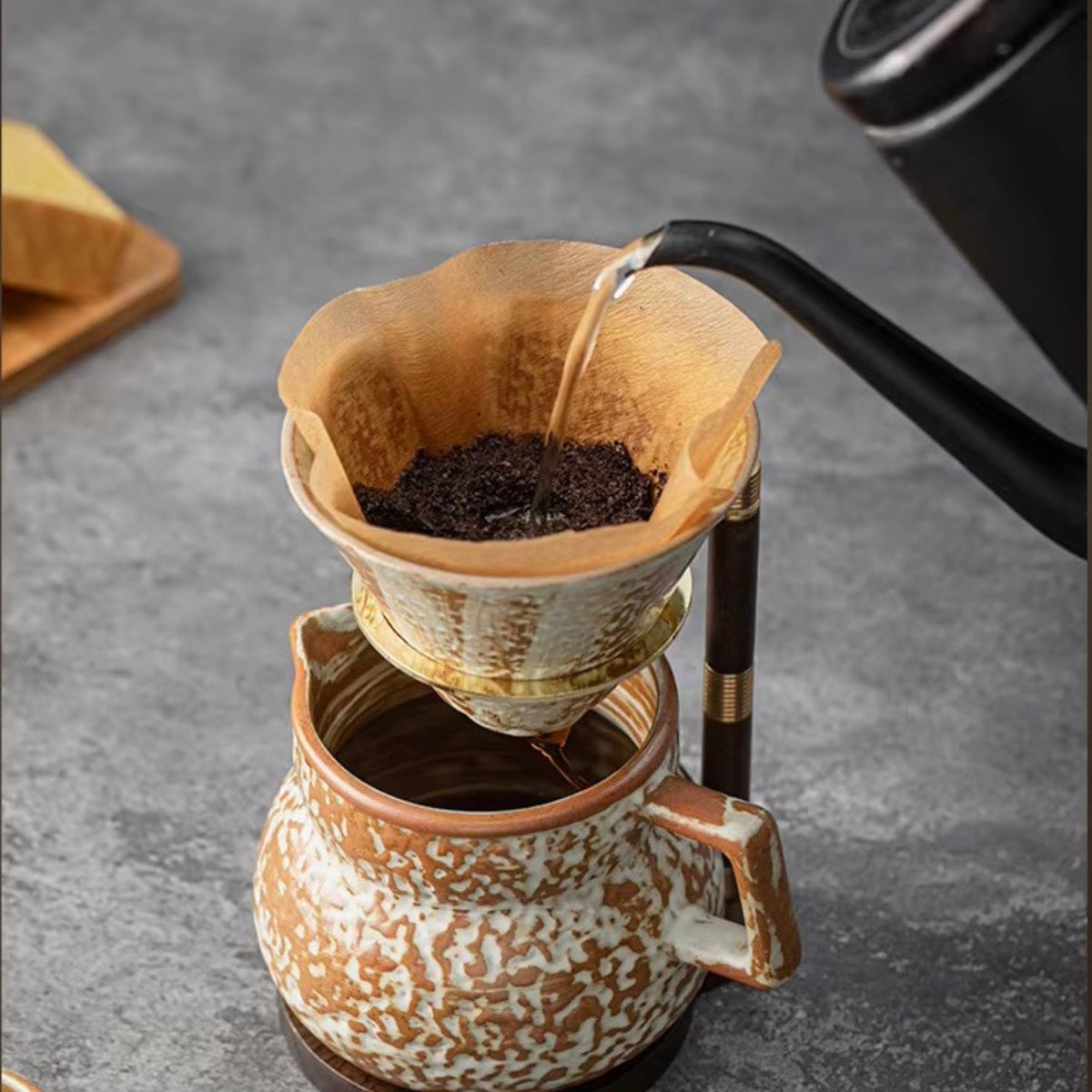 Handcrafted coffee stand featuring a ceramic dripper and a stylish wooden base, ideal for elegant pour-over brewing. 1