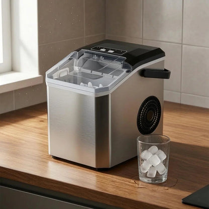 Compact Bullet Ice Maker with transparent lid, designed for home and office use, producing clear ice cubes efficiently on a sleek countertop. 6