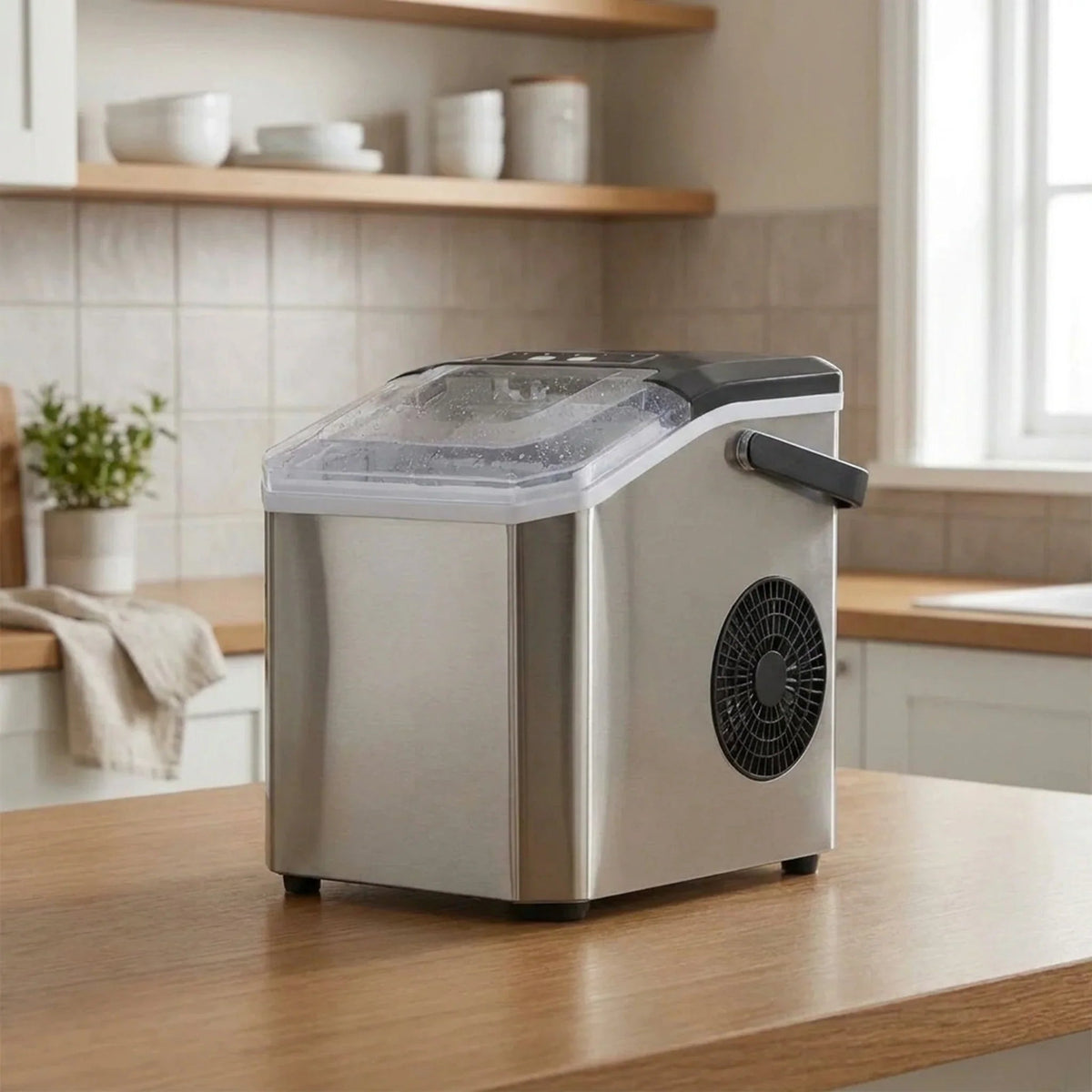 Compact Bullet Ice Maker with transparent lid, designed for home and office use, producing clear ice cubes efficiently on a sleek countertop. 0