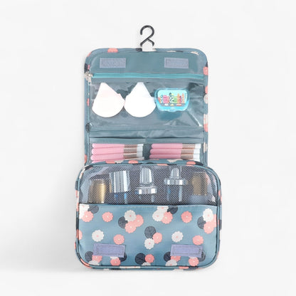 Compact hanging toiletry bag featuring a water-repellent surface and a vibrant floral print, designed as an organizer for women's travel essentials. 3
