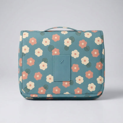 Compact hanging toiletry bag featuring a water-repellent surface and a vibrant floral print, designed as an organizer for women's travel essentials. 4