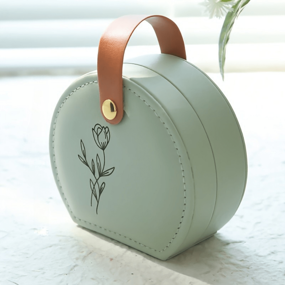 Compact jewelry box organizer made of travel-friendly PU leather, featuring a personalized name, perfect for keeping your accessories tidy and stylish on the go. 1