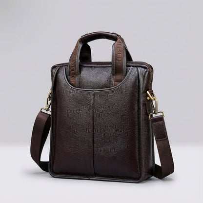 Compact brown leather shoulder bag made from genuine calf leather, featuring an adjustable strap for versatile wear. 1