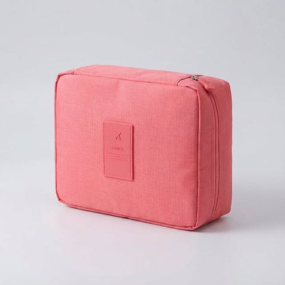 Compact makeup bag featuring waterproof fabric and multiple compartments for organized storage of cosmetics and beauty essentials. 4