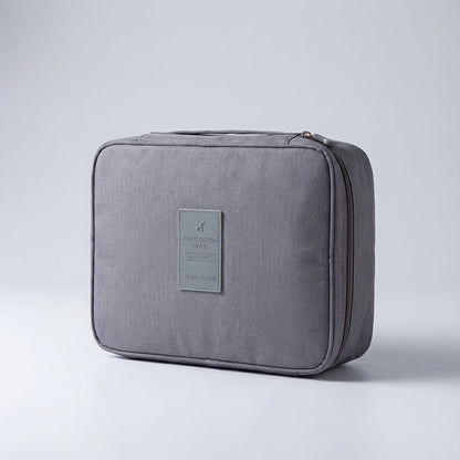 Compact makeup bag featuring waterproof fabric and multiple compartments for organized storage of cosmetics and beauty essentials. 7