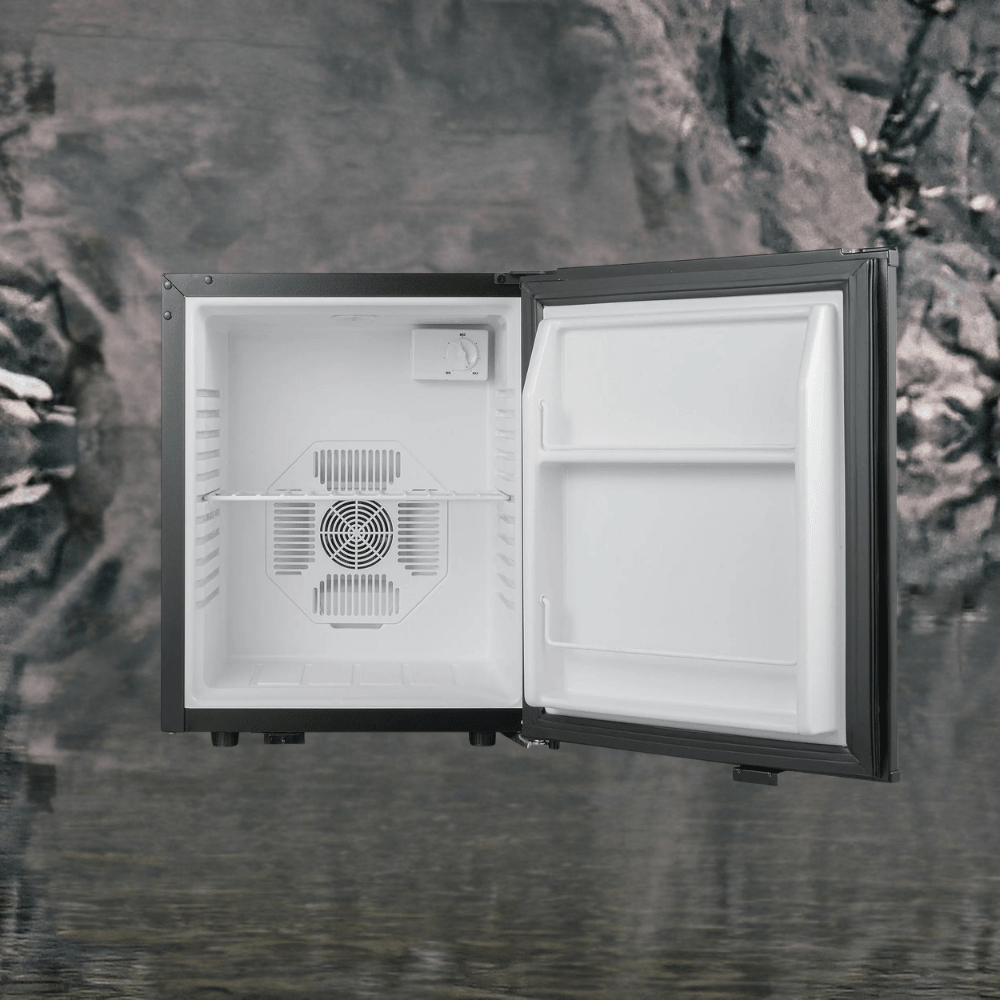 Compact mini fridge with auto-defrost feature, designed for bedrooms, showcasing a sleek black solid door, perfect for storing beverages and snacks. 1