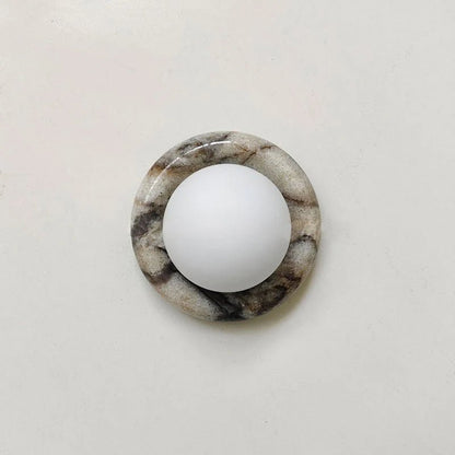 Compact Onyx Wall Light featuring a sleek design with a soft white glass diffuser, ideal for creating ambient lighting; dimmable hardwired fixture perfect for 9