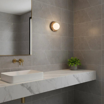 Compact Onyx Wall Light featuring a sleek design with a soft white glass diffuser, ideal for creating ambient lighting; dimmable hardwired fixture perfect for 14