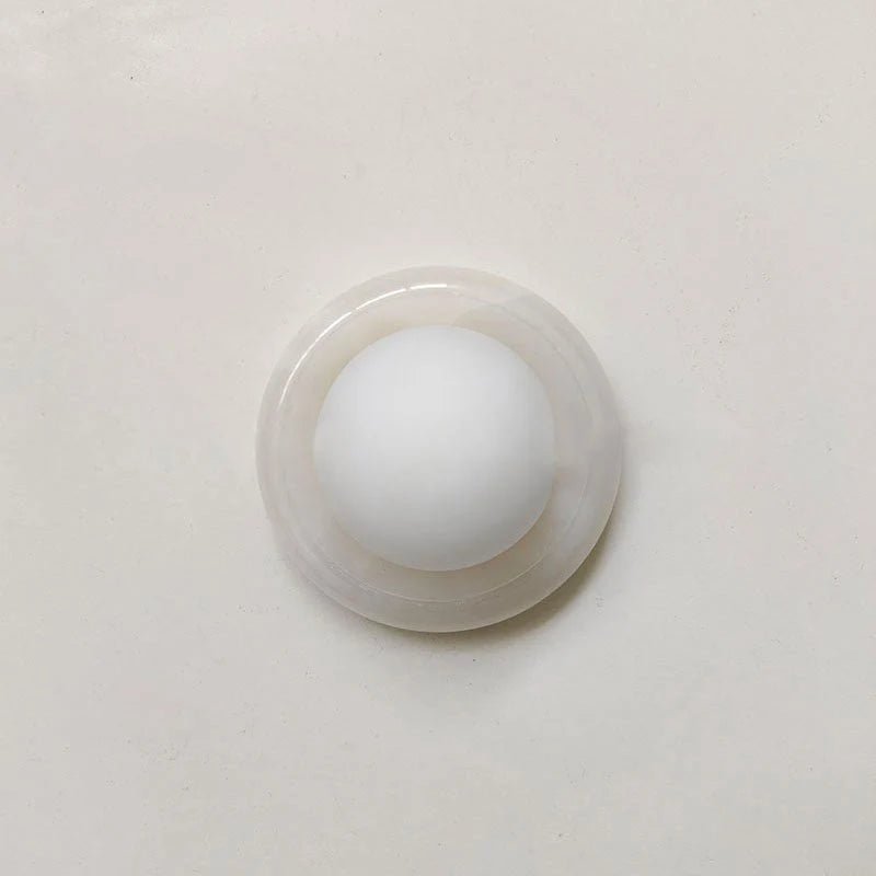 Compact Onyx Wall Light featuring a sleek design with a soft white glass diffuser, ideal for creating ambient lighting; dimmable hardwired fixture perfect for 0