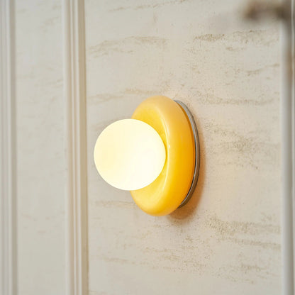 Compact Onyx Wall Light featuring a sleek design with a soft white glass diffuser, ideal for creating ambient lighting; dimmable hardwired fixture perfect for 3
