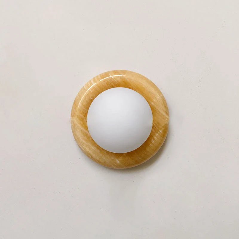Compact Onyx Wall Light featuring a sleek design with a soft white glass diffuser, ideal for creating ambient lighting; dimmable hardwired fixture perfect for 10