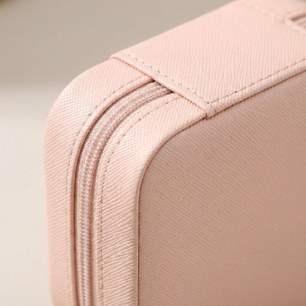 Compact travel jewelry box featuring a soft leather finish, designed for lightweight portability and protective storage of jewelry items. 3