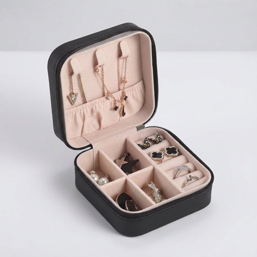 Compact travel jewelry box featuring a soft leather finish, designed for lightweight portability and protective storage of jewelry items. 2