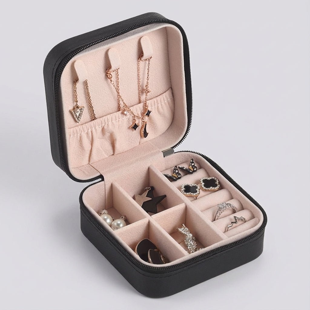 Compact travel jewelry box featuring a soft leather finish, designed for lightweight portability and protective storage of jewelry items. 0