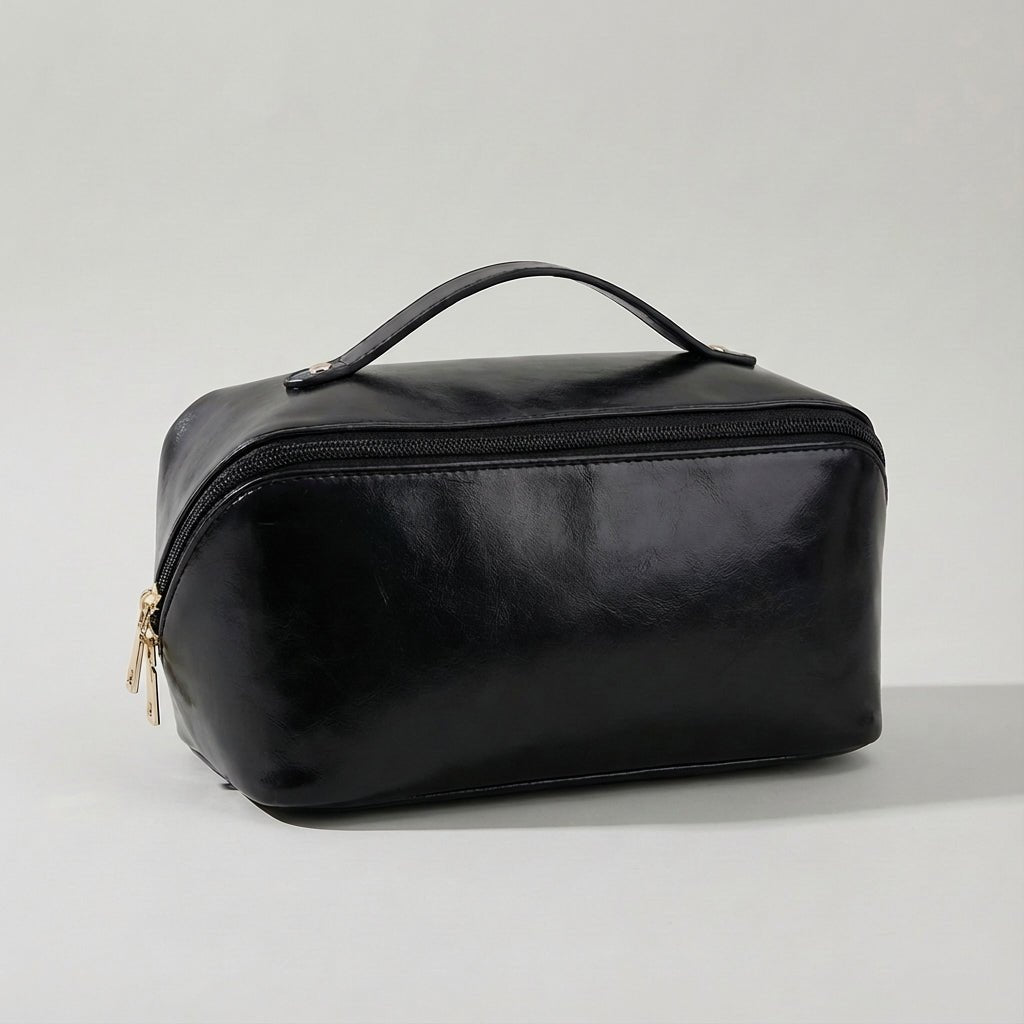Compact travel makeup bag featuring multiple compartments and a sturdy handle, designed for organizing beauty essentials in a glossy cosmetic pouch. 4