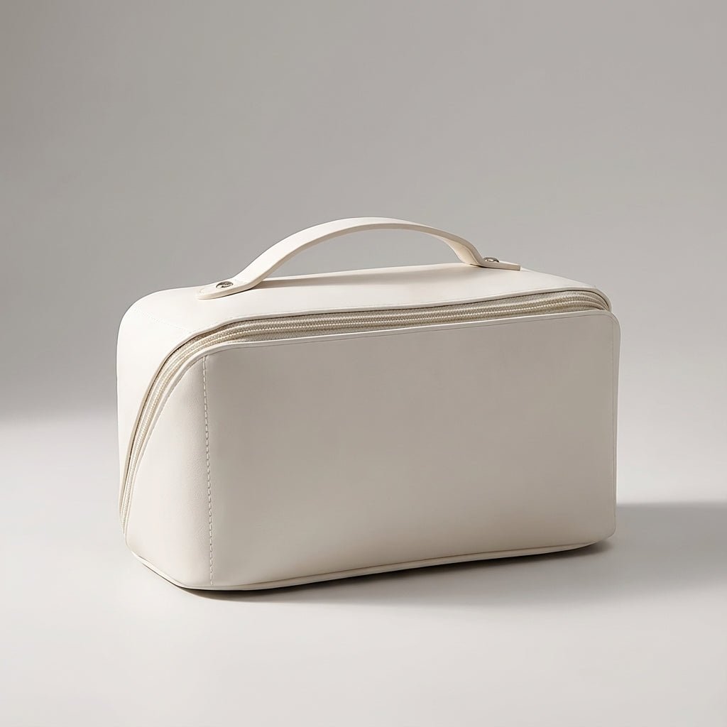 Compact travel makeup bag featuring multiple compartments and a sturdy handle, designed for organizing beauty essentials in a glossy cosmetic pouch. 2