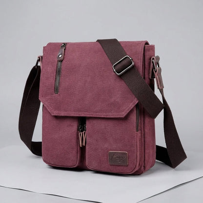 Compact vintage messenger bag made of durable canvas and PU leather, featuring an adjustable strap and a secure anti-theft pocket for added safety and style. 2