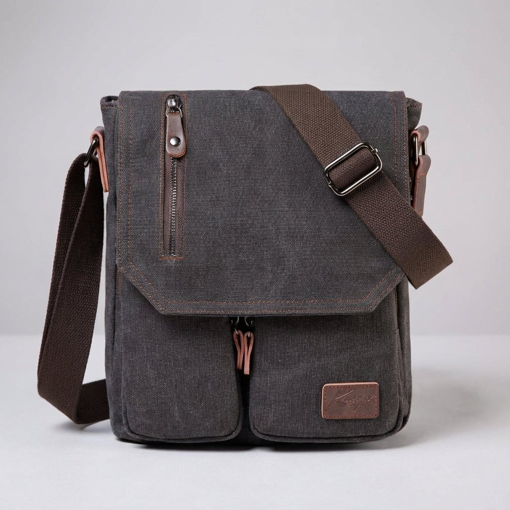Compact vintage messenger bag made of durable canvas and PU leather, featuring an adjustable strap and a secure anti-theft pocket for added safety and style. 0