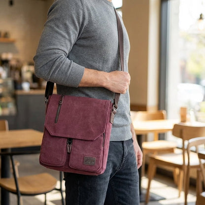 Compact vintage messenger bag made of durable canvas and PU leather, featuring an adjustable strap and a secure anti-theft pocket for added safety and style. 1