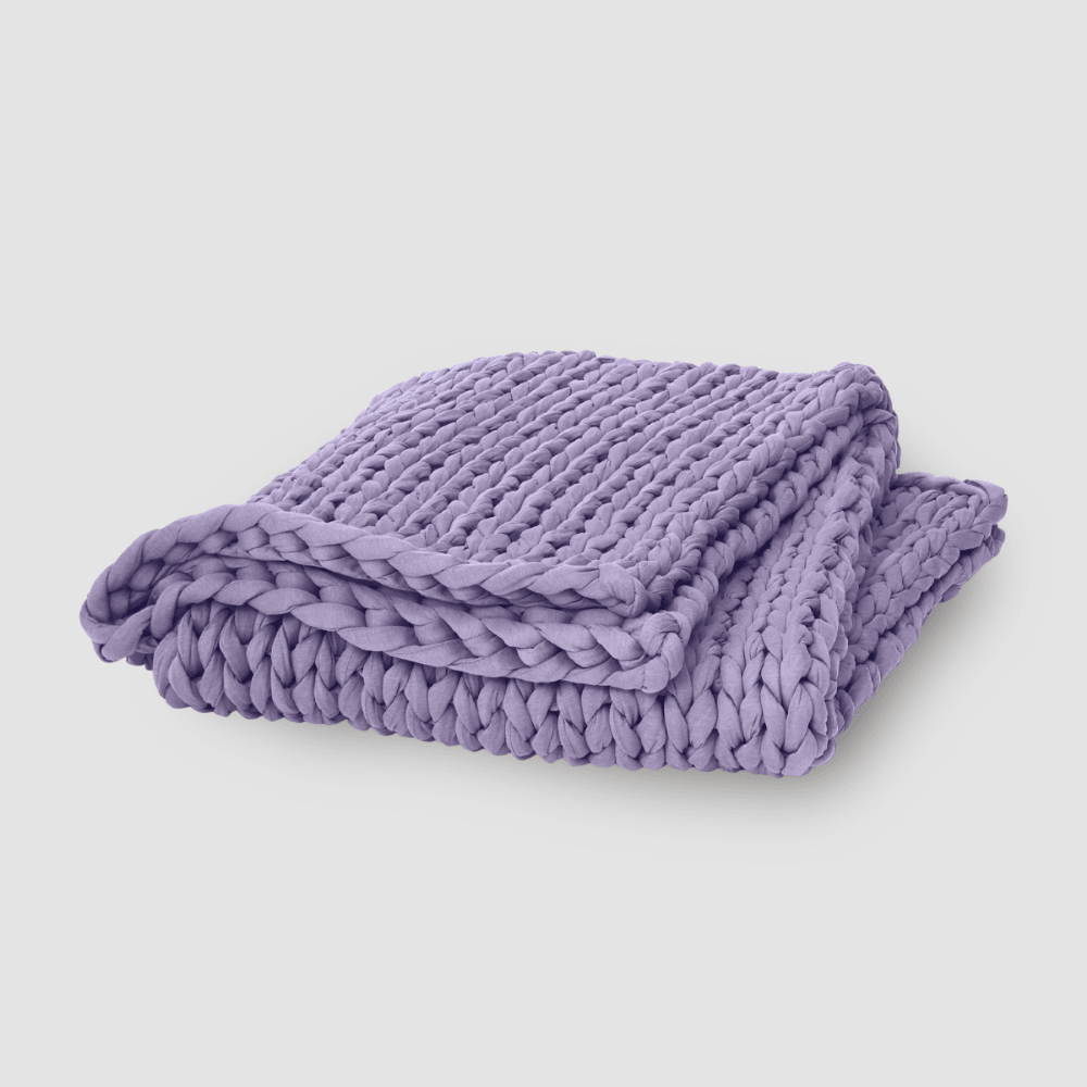 Cooling weighted blanket featuring a knit chunky design, made from breathable TENCEL™ fabric, available in various colors for enhanced comfort and style. 0