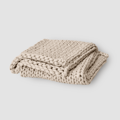 Cooling weighted blanket featuring a knit chunky design, made from breathable TENCEL™ fabric, available in various colors for enhanced comfort and style. 2