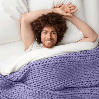 Cooling weighted blanket featuring a knit chunky design, made from breathable TENCEL™ fabric, available in various colors for enhanced comfort and style. 5