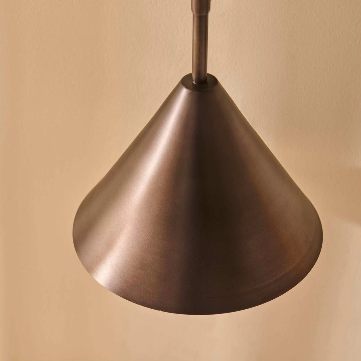 Copper wall lamp featuring a sleek conical shade, available in elegant gold or black finishes, perfect for contemporary home decor. 6