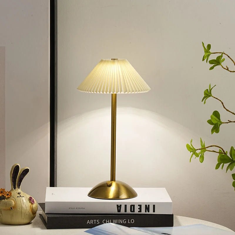 Scandinavian style cordless table lamp featuring a pleated fabric shade and sturdy iron base, perfect for enhancing the ambiance of bedrooms or dining areas. 3
