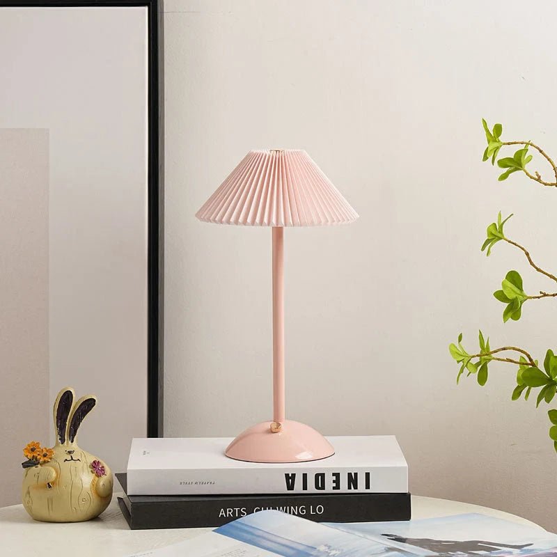 Scandinavian style cordless table lamp featuring a pleated fabric shade and sturdy iron base, perfect for enhancing the ambiance of bedrooms or dining areas. 15