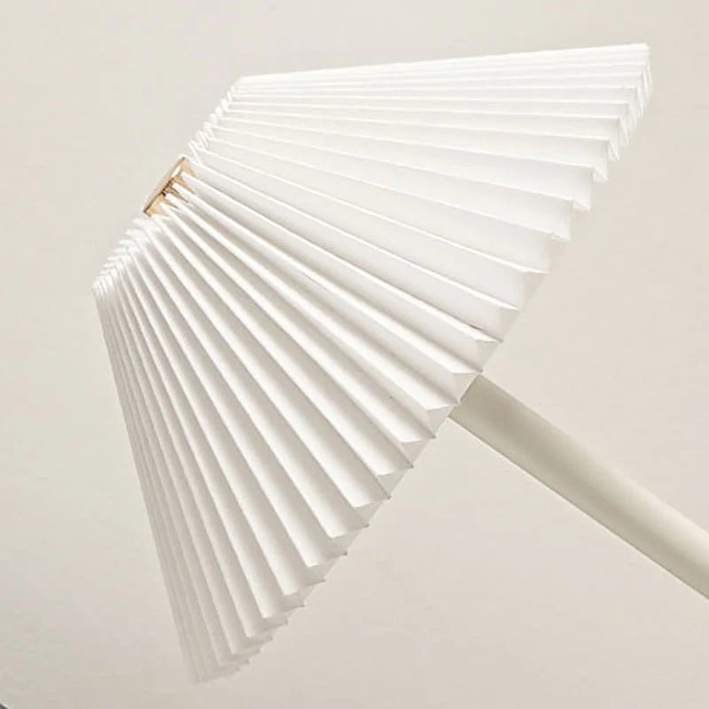 Scandinavian style cordless table lamp featuring a pleated fabric shade and sturdy iron base, perfect for enhancing the ambiance of bedrooms or dining areas. 7