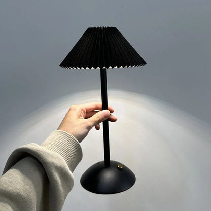 Scandinavian style cordless table lamp featuring a pleated fabric shade and sturdy iron base, perfect for enhancing the ambiance of bedrooms or dining areas. 13