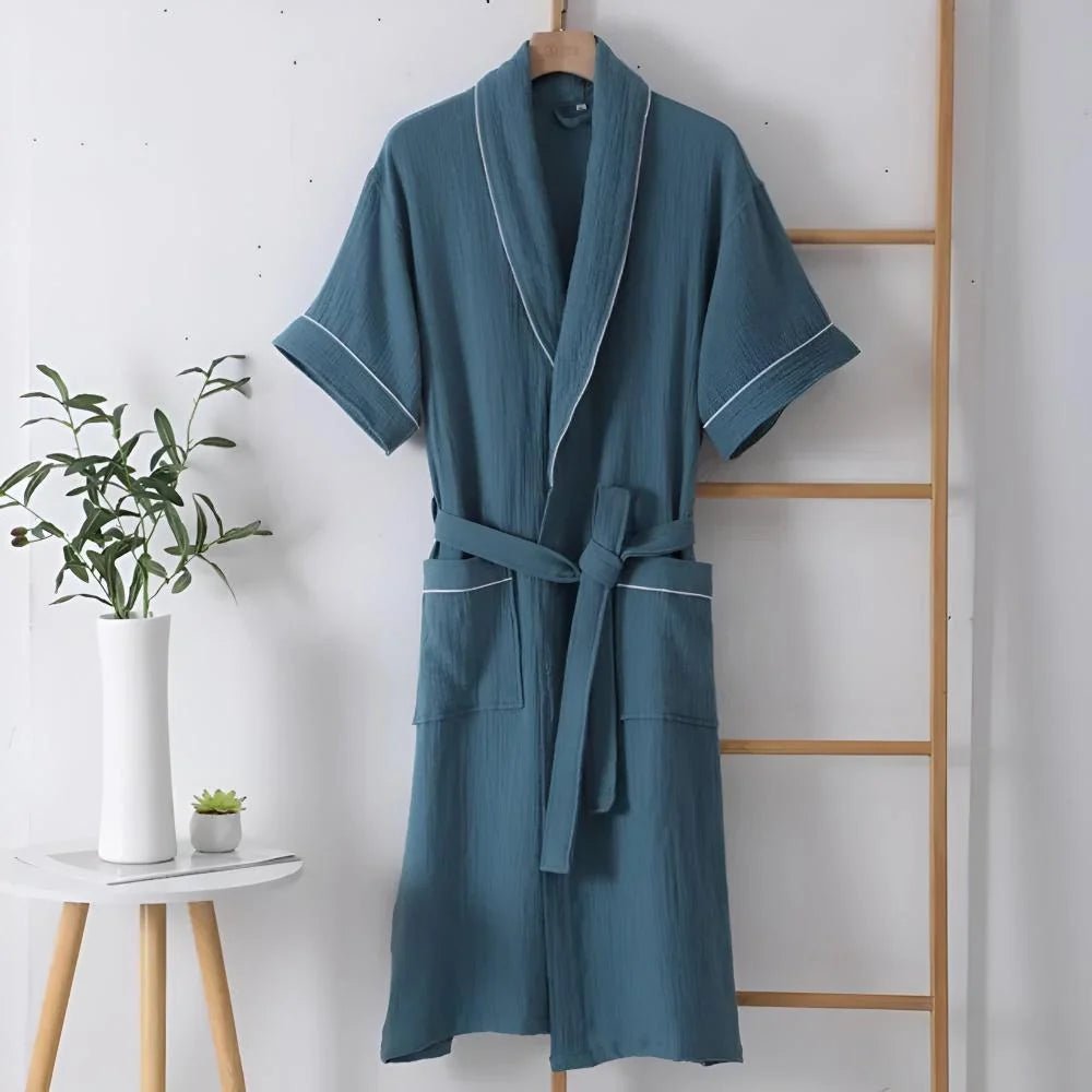 Cotton bathrobe for women with short sleeves, featuring a relaxed fit in double muslin fabric, designed for breathability and lightweight comfort. 0