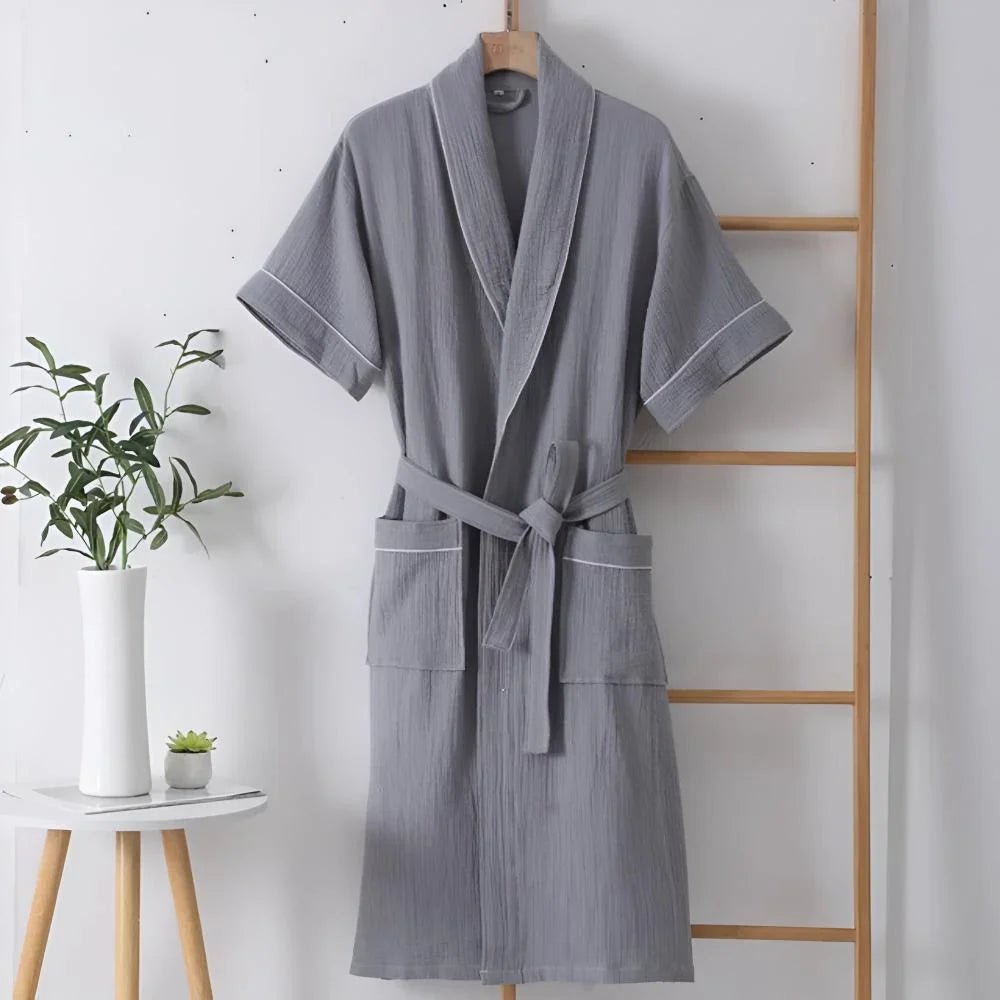 Cotton bathrobe for women with short sleeves, featuring a relaxed fit in double muslin fabric, designed for breathability and lightweight comfort. 5