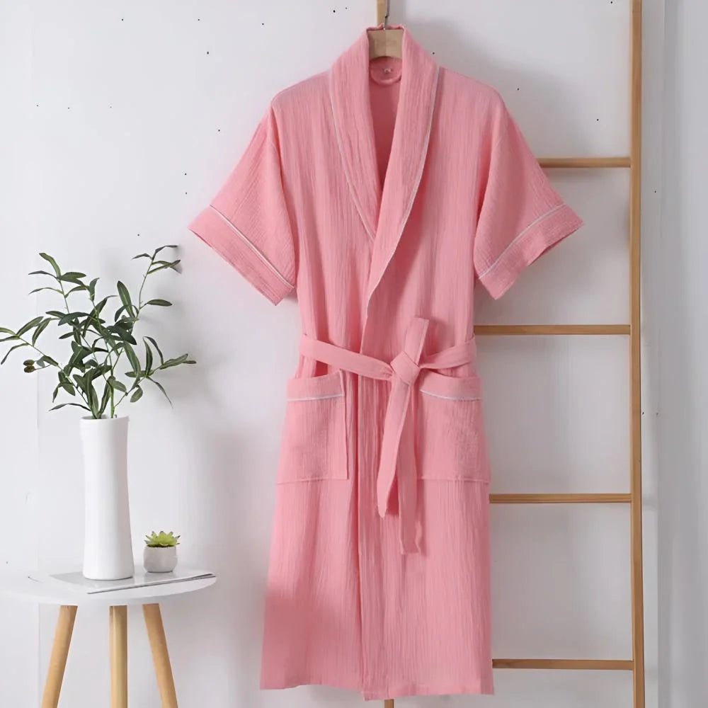 Cotton bathrobe for women with short sleeves, featuring a relaxed fit in double muslin fabric, designed for breathability and lightweight comfort. 4