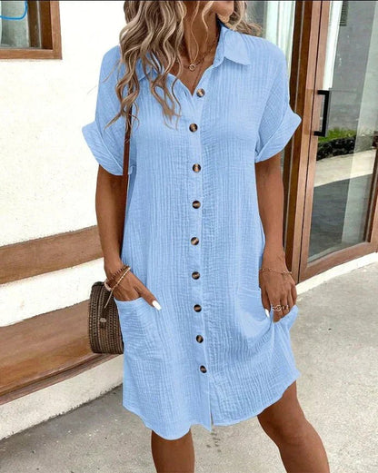 Cotton shirt dress featuring full-length button closure and turned-up sleeves, perfect for casual summer outings, knee-length design in a stylish and comfortable fit. 2