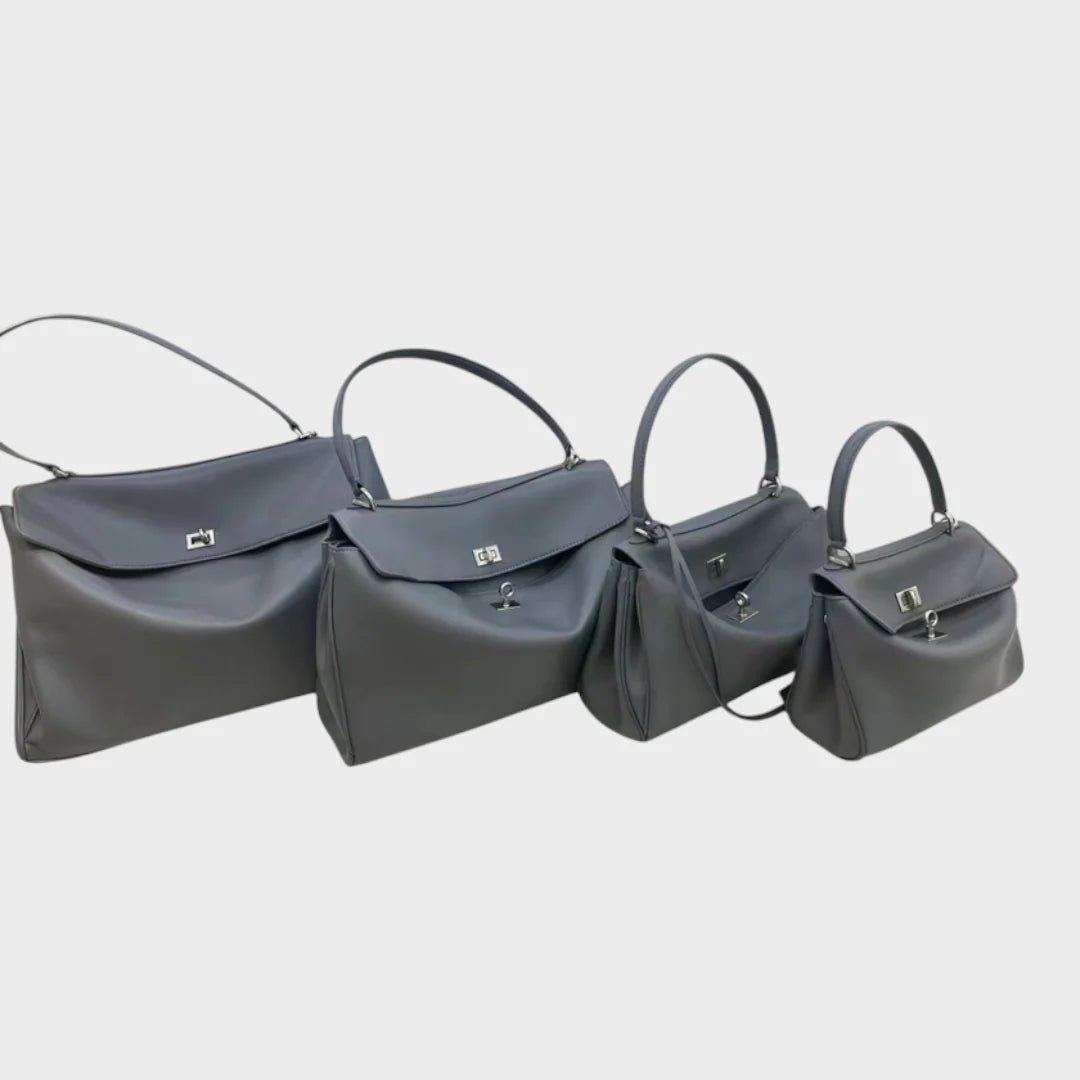 Cowhide leather shoulder bag featuring a magnetic flap closure, adjustable strap, and a lined interior for organized storage. 9