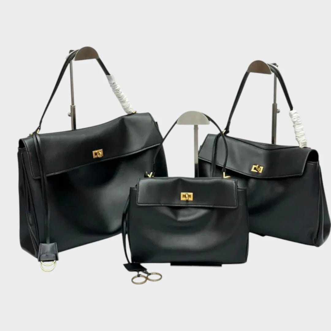 Cowhide leather shoulder bag featuring a magnetic flap closure, adjustable strap, and a lined interior for organized storage. 3