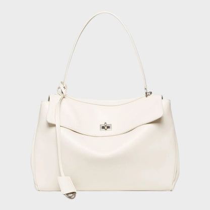 Cowhide leather shoulder bag featuring a magnetic flap closure, adjustable strap, and a lined interior for organized storage. 8
