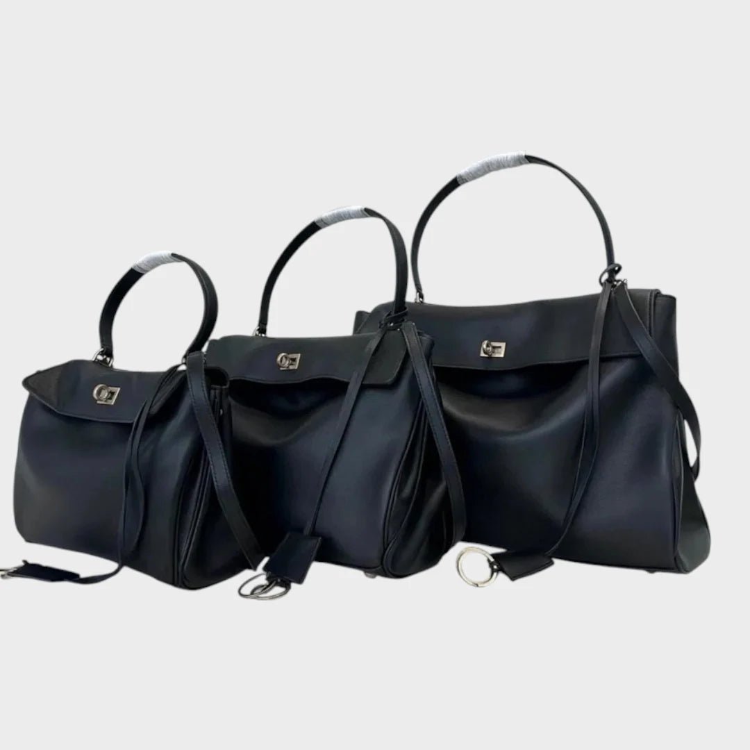Cowhide leather shoulder bag featuring a magnetic flap closure, adjustable strap, and a lined interior for organized storage. 4
