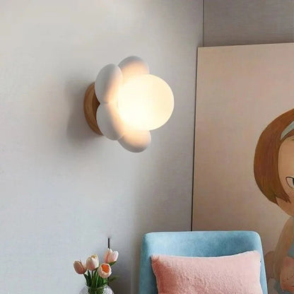 Cream wall lamp featuring a delicate floral design, emitting soft LED light perfect for elegant wall sconce lighting in any decor. 0