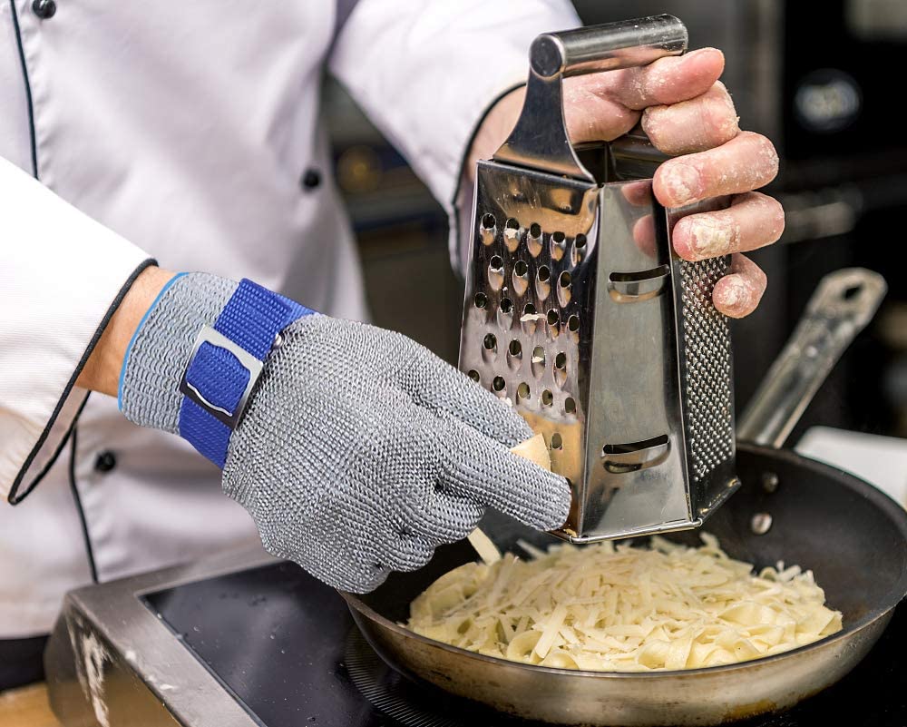 Cut resistant gloves featuring adjustable cuffs made of durable stainless steel mesh, designed for safe handling and protection in industrial and kitchen environments. 2