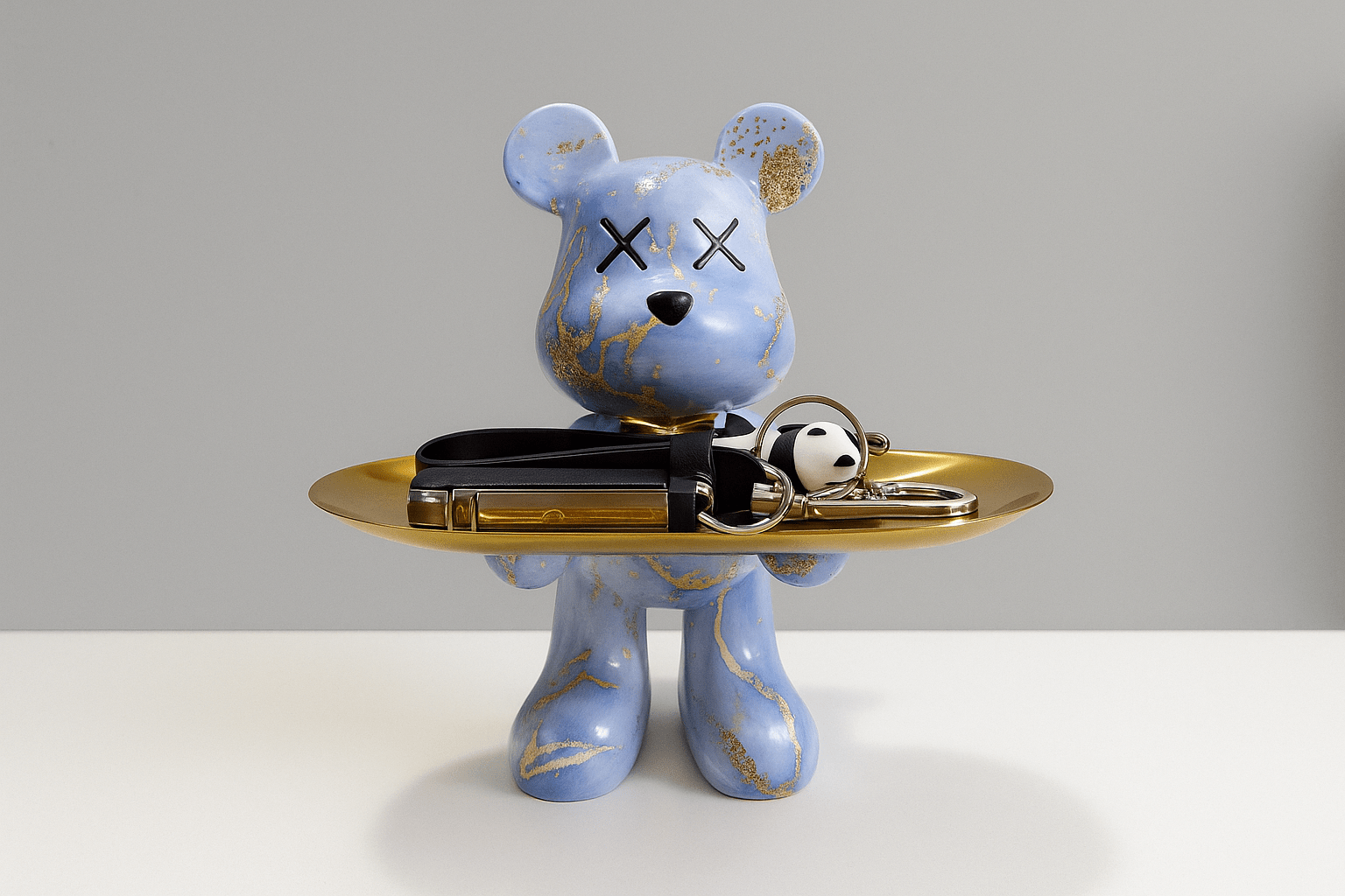 Decorative bear statue in graffiti style holding a gold bowl, perfect for modern home decor and unique accents. 0